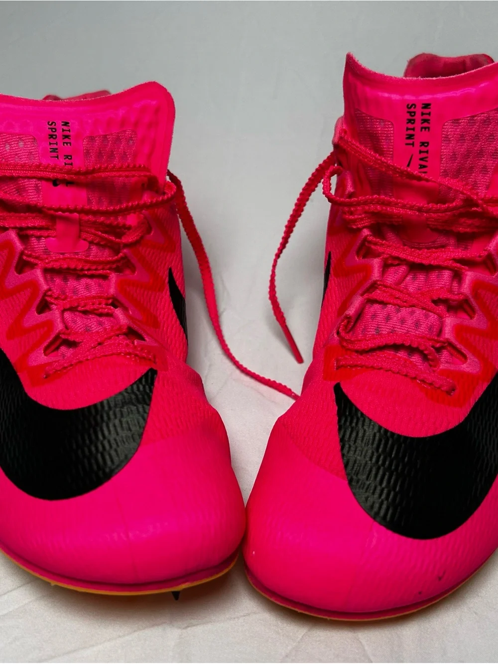 Nike Bright Pink Athletic track with Black Swoosh men’s 10/1/2